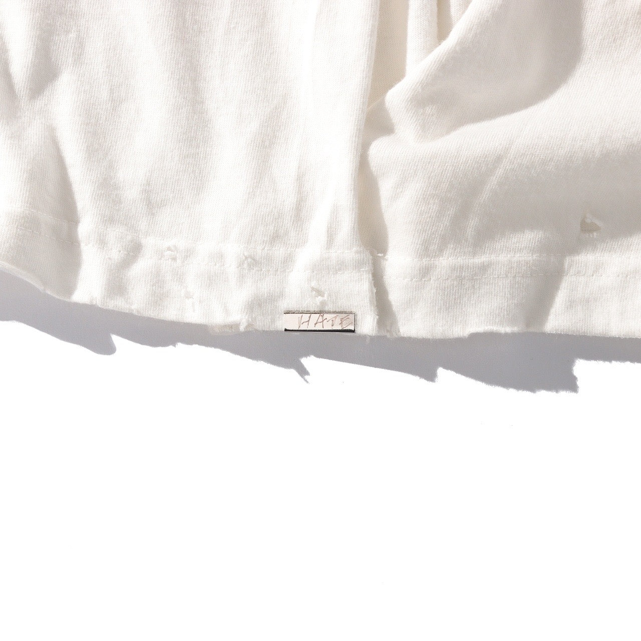 ORGANIC COTTON DAMAGE LONG T-SHIRT CUT OFF